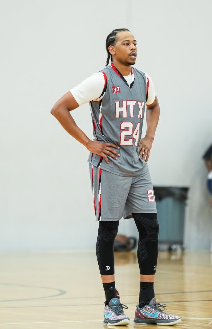 Player wearing the full gray HTX number 24 jersey and shorts with red and white trim