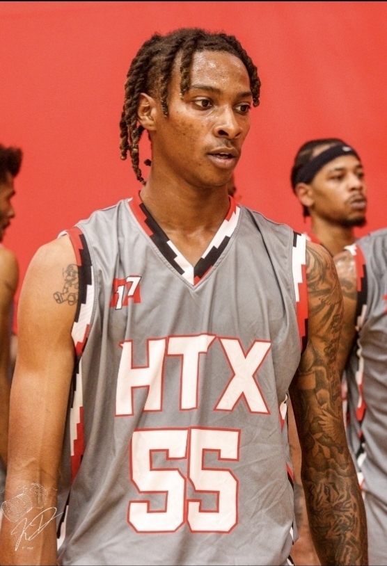 Close-up of the gray HTX number 55 basketball jersey with custom red and white lettering